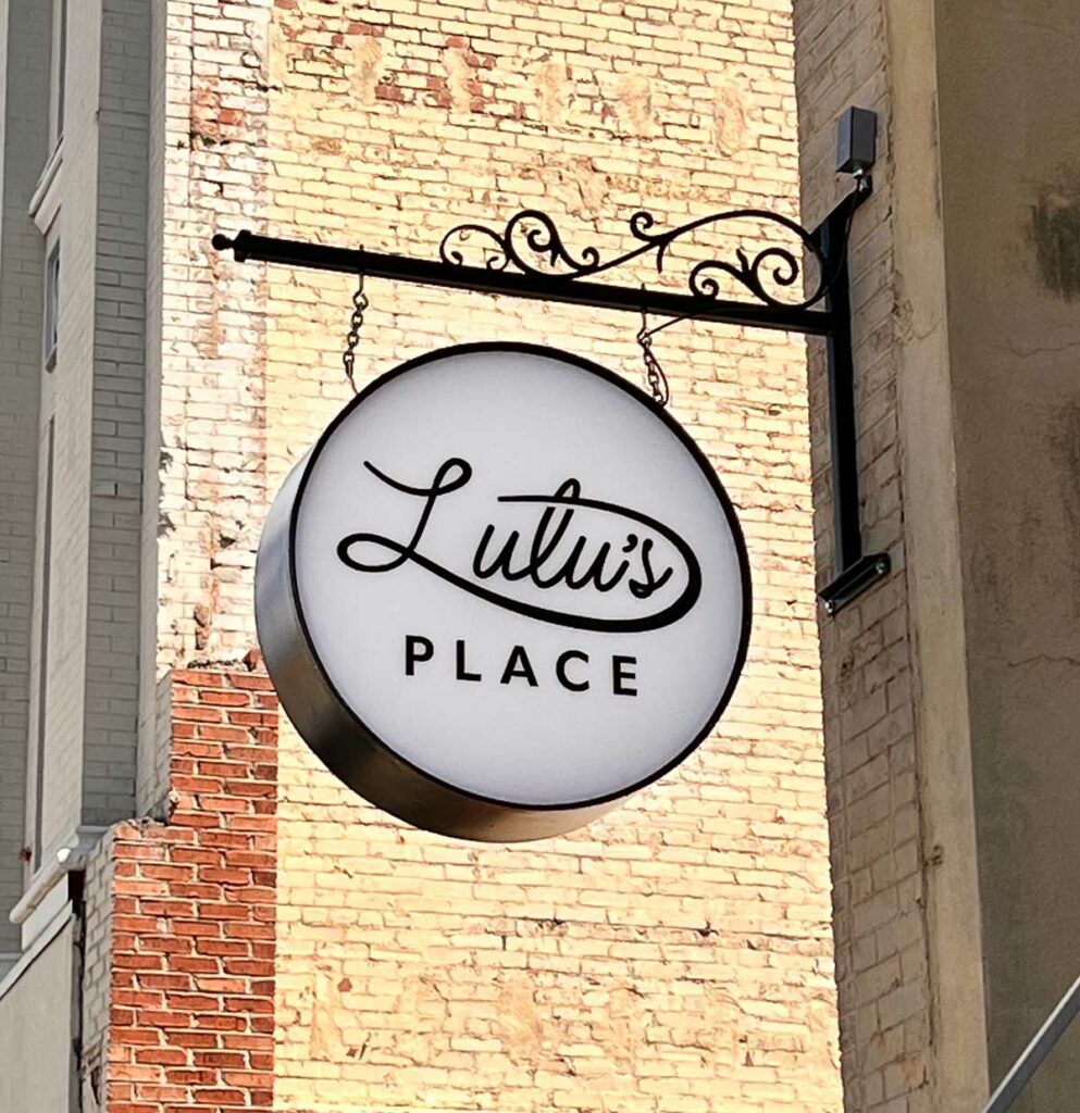 lulu's place sign on outside of restaurant